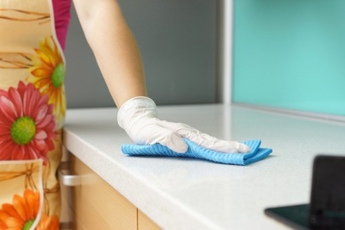 Cleaning staff following safe work practices during a routine service