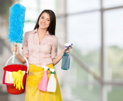 Eco-friendly cleaner in Knightsbridge with cleaning supplies