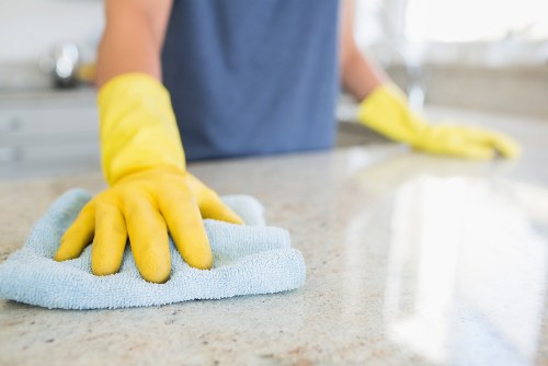 Dusting and vacuuming living room areas during a Knightsbridge move-out clean